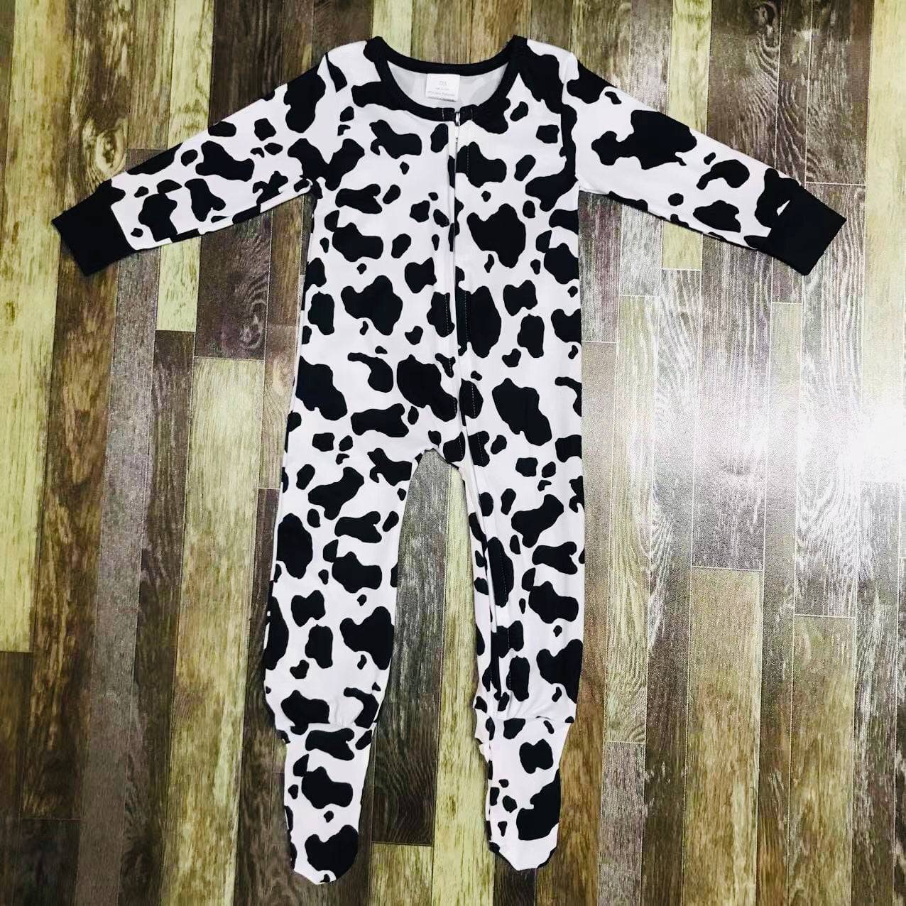 Cow print zip up romper